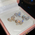 Crystal Bow Stud Earrings in Silver and Gold with Polished Metal Details view 2