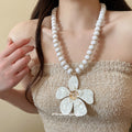 White Beaded Necklace With Large Five Petal Flower Pendant view 3