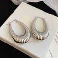 Textured and Polished Oval Hoop Earrings in Gold and Silver view 8