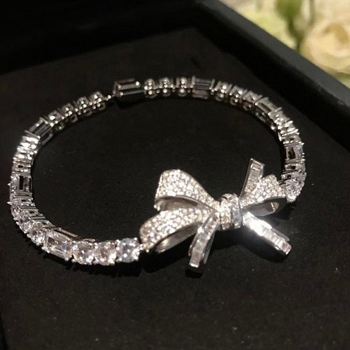 silver-tone clear crystal bracelet with a large bow center shown in the first close product view