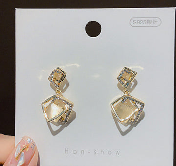 Geometric Cat Eye Earring Collection with Sculpted Polished Metal Details