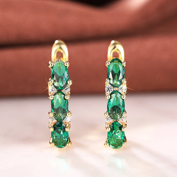 Green Oval Three-Stone Long Drop Earrings In Polished Gold Tone