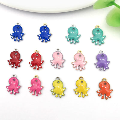 Gold-tone octopus charms arranged on a light background