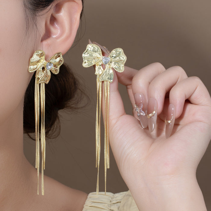 Gold Tone Sculptural Bow and Four Bar Tassel Earrings