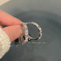 Clear Faceted Stone Crossover Huggie Hoop Earrings view 4