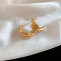 Crossed Triple Hoop Earrings in Gold and Silver Tone view 6