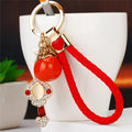 Braided Ruyi Persimmon Wrist Strap Keychains in Three Colors view 1