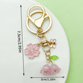 Flower Charm Keychains Featuring Pink Butterfly Across 10 Pictured Variations view 7