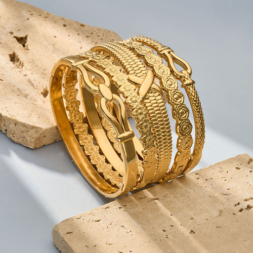 Display view of patterned gold and silver hinged bangles in main image 2.
