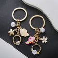 Pink Butterfly White Flower and Pearl-Look Wreath Keychain view 2