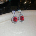 Silver Tone Crystal Oval Drop Earrings With Glossy Red Centers view 4