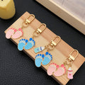 Fourteen Pink and Blue Baby Footprint Metal Keychain Designs view 4