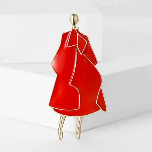 Red enamel fashion coat figure brooch upright on white blocks
