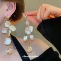Gold Tone Long Drop Earrings With Irregular Shell Like Pieces view 3