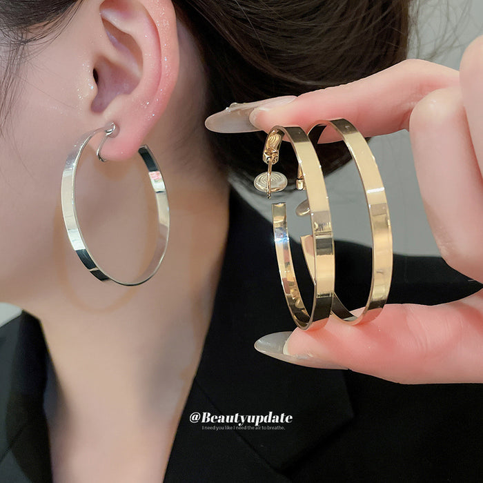 Oversized Polished Hoop Earrings with Distinctive Textured Details