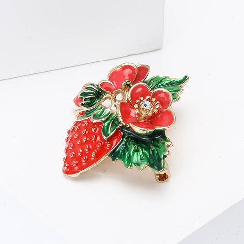 Red strawberry and flower cluster with green leaves brooch styled display
