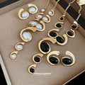 Gold Oval Cabochon Swirl Tassel Necklace And Earrings Set view 3