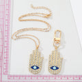 Gold Tone Crystal Hamsa Eye Necklace and Clip Keychain Options view 2