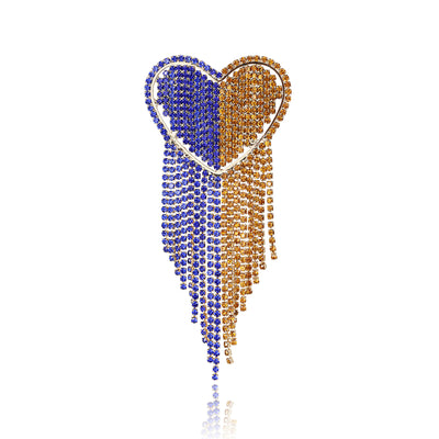Front view of the blue and gold crystal heart tassel brooch decorative clothing pin on a white background