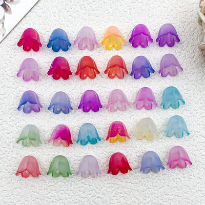 Multicolor flower charms arranged on a light background