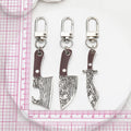Silver Tone Faux Woodgrain Knife and Cleaver Clip Keychains view 4
