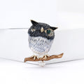 Single Eye Metal Owl on Branch Brooch in Brown and Blue view 4