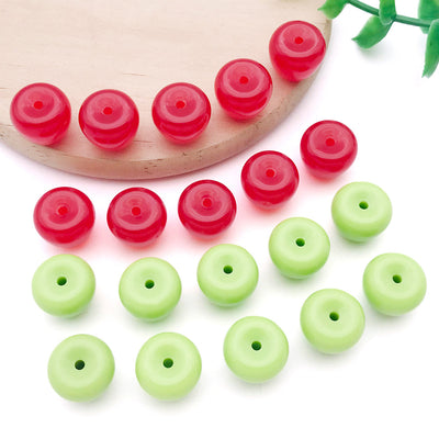 Red and green apple shaped acrylic beads arranged as a full product overview