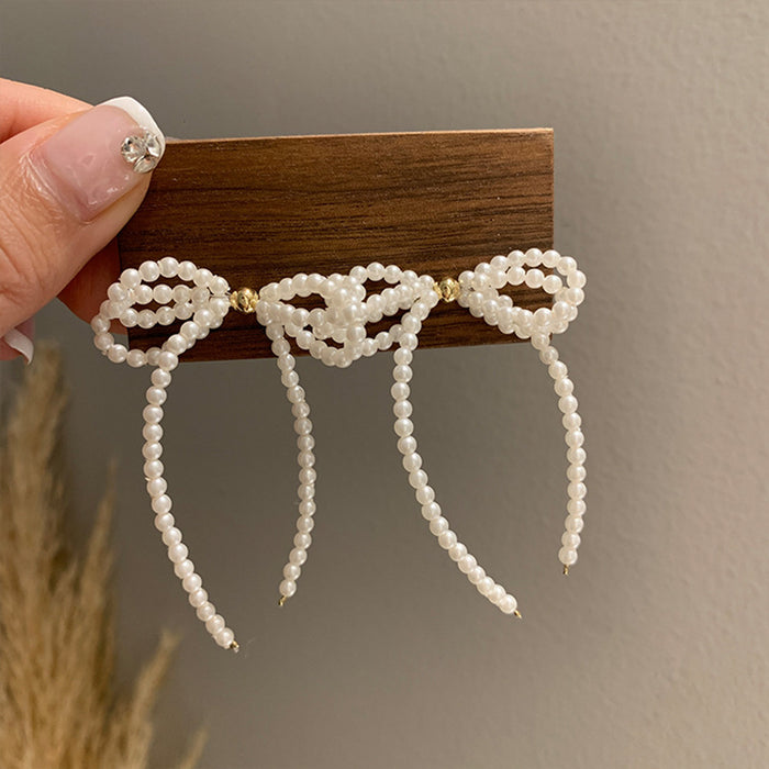 White Bow Pearl Chain Drop Earrings with Polished Metal Accents