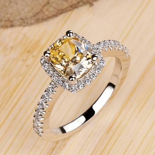 Second product view showing silver-tone yellow cushion solitaire halo ring