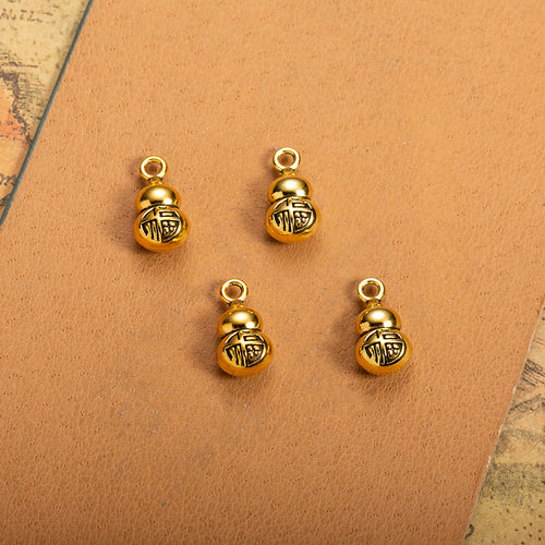 Second product image of the lucky gourd charm showing a small double-lobed gourd with a raised character on the front