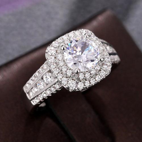 Display view of silver tone round crystal double halo three band ring