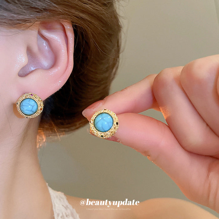 Gold Tone Round Blue Stone Stud Earrings with Textured Rims
