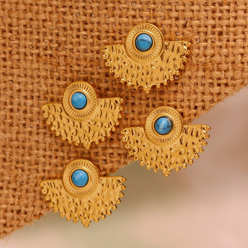 Four gold fan peacock studs with turquoise on burlap