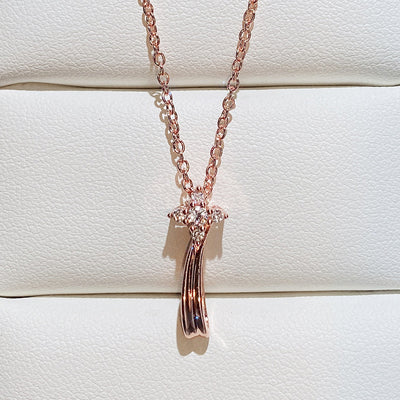 Rose Gold Tone shooting star pendant shown in front detail view