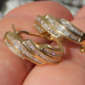 Gold Tone Twisted Baguette Stone Huggie Hoop Earrings view 2