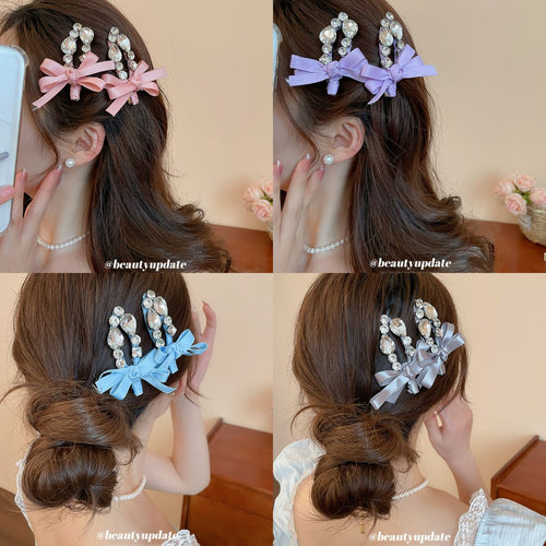 pink white lavender and blue crystal bow duckbill hair clips grouped together