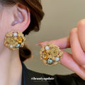 Gold Tone Round Floral Stud Earrings With Pearl Like Accents view 1