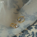 Gold Mini Huggie Hoop Side Set Clear Crystal Earrings view 6