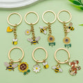 Bee and Honeycomb Charm Keychains Featuring Bee Across 10 Pictured Variations view 4