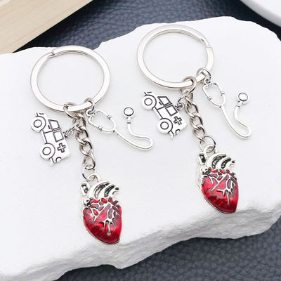 Main display of ambulance stethoscope syringe and red heart keychains
