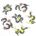 Black Enamel Skull and Snake Charms in Six Coiled Designs view 3