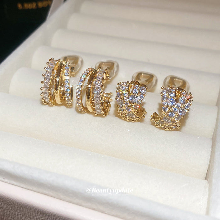 Triple Row Crystal C Hoop Clip On Earrings With Polished Metal Details