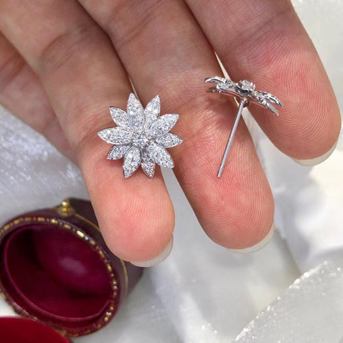 Display view of silver tone marquise crystal flower stud earrings polished metal jewelry