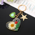 Clear Resin Pressed Flower Heart Clip Keychains in Five Designs view 7