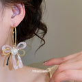 Pink Iridescent Bow Dangle Earrings With Gold Tone Hooks view 3