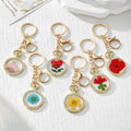 Round Pressed Flower Keychains with Split Rings and Clips view 1