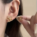Open Outline Five Petal Flower Stud Earrings in Gold Tone view 4