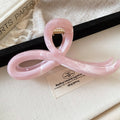 Crossed Loop Acrylic Hair Claw In Pink Marbled Or Gray Black view 6