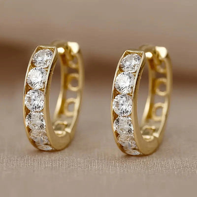 Gold clear CZ pave mini huggie hoop earrings pair front three-quarter view