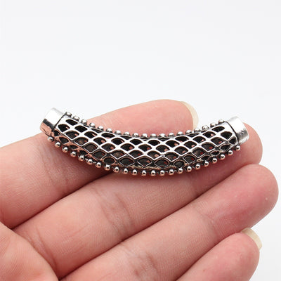 Open Diamond Lattice Curved Tube Connector shown in hand